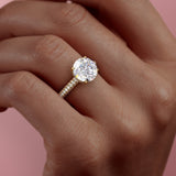 ROUND CUT MOISSANITE PAVÉ SET SHOULDERS WITH HIDDEN HALO