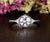 Round Cut Moissanite Engagement Ring, Art Deco Trilogy Design